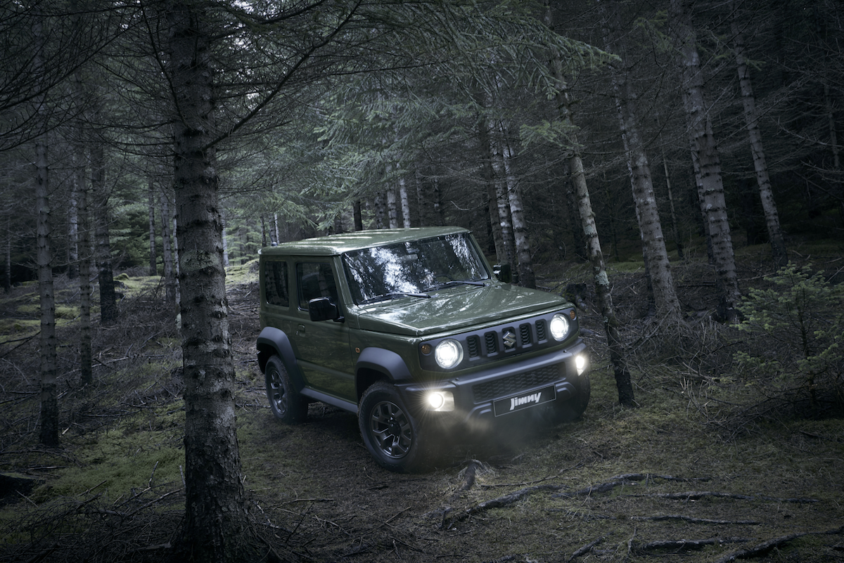 Front view of a Suzuki Jimny offroad in the treess